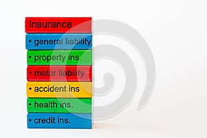 Colorful blocks with the words: insurance, genaral liability, property insurance, motor liability,accident ins. , health ins. , cr