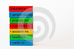 Colorful blocks with the words: insurance, genaral liability, property insurance, motor liability,accident ins. , health ins. , cr photo