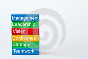 Colorful blocks with the words: management, leadership, vision, strategy, teamwork isolated against a white background with space