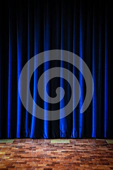 Colorful blue stage curtains and tiled floor