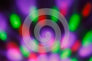 Colorful blurred bokeh with night light. Abstract festive background, pattern. Defocused illuminated dark backdrop. Lights disco b