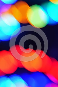 Colorful blurred festive Christmas holidays lights at night