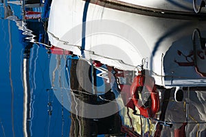 Colorful Boat Hull Reflection and Clear Ocean Water