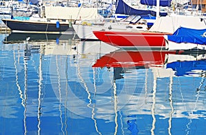 Colorful boat reflections at Piraeus port Greece