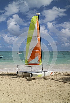 Colorful boat at white sand in Caribbean beach in Dominican Republic