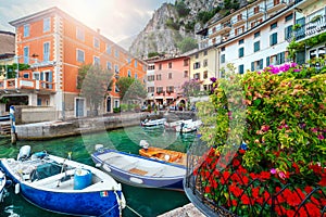 Colorful boats in harbor of Limone sul Garda, Lombardy, Italy photo
