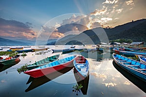 Colorful boats in Phewa lake in Pokhara, Nepal