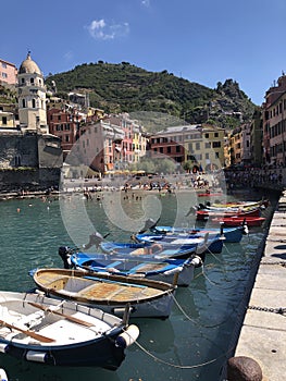 Colorful boats in the small marina or harbor of Vernazza