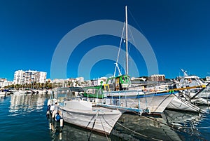 Colorful boats, sunny morning in harbor of St Antoni de Portmany, Ibiza town, Balearic Islands, Spain.