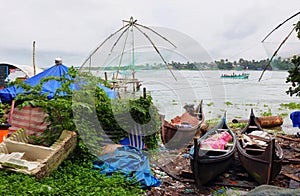 Colorful boats with tradional Chinese fishing nets at background in Cochin, Kerala, India