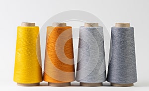 colorful bobbins of thread isolated on white background