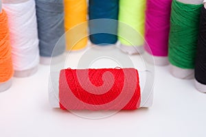 Colorful bobbins on white background