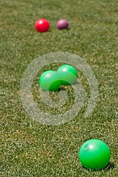 Colorful Bocce Balls in Green Grass