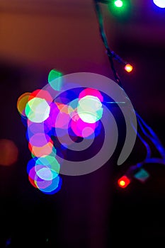 Colorful bokeh of christmas tree garland lights