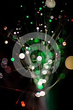 Colorful bokeh circle light celebrate at night, defocus light abstract green background.