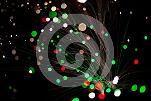 Colorful bokeh circle light celebrate at night, defocus light abstract green and red background.