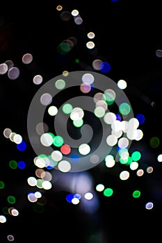 Colorful bokeh light celebrate at night, defocus light abstract background.