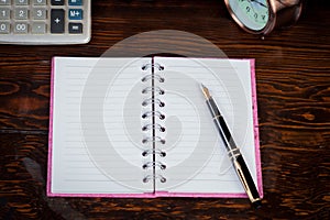 Colorful Book note and fountain pen on wood