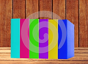 Colorful books on wooden table