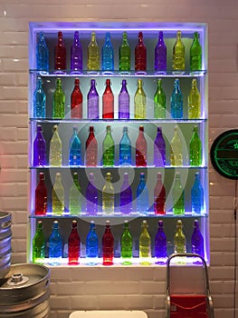 Colorful Bottles on glass shelf