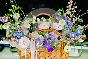 a colorful bouquet of flowers in the basket. a bright gift for a woman