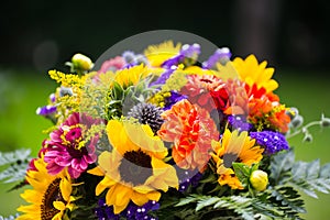 Colorful bouquet with sunflowers in the garden photo