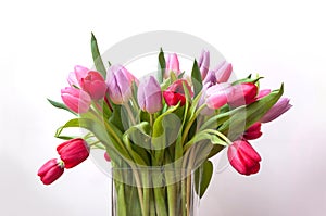 colorful bouquet of tulips in a transparent vase