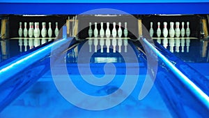 Colorful bowling alley. Bowling lane waiting for gamers. Colorful Illumination