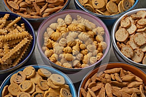 Colorful bowls with a variation of traditional Krichlate spicy miniature shortbread cookies