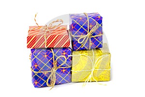 Colorful boxes with gifts tied with ropes on a white background