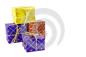 Colorful boxes with gifts tied with ropes on a white background