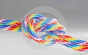 Colorful braided cords tied together isolated