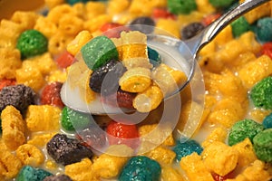 Colorful Breakfast Cereal in Milk with Spoon