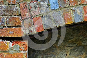 A colorful brick pattern on old derelict fireplace