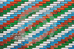 Colorful brick wall with diagonal pattern with white, blue, red and green colors