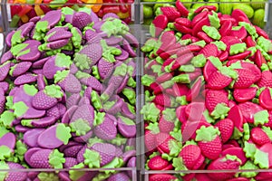 Colorful bright chewy candies covered with sugar. Rainbow ribbon candies. Colorful jelly candies close up as a bright joyful