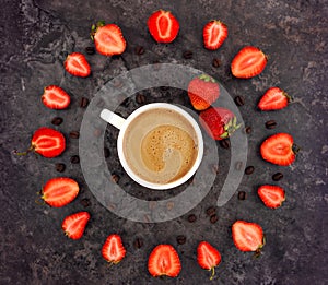 Colorful bright composition of cup of coffee and strawberries flower