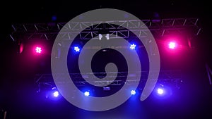 Colorful bright concert lighting equipment for stage at nightclub