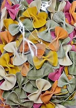 Colorful bright pasta in the form of bows close-up