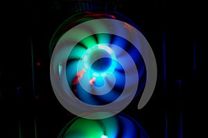 Colorful bright rainbow led rgb pc fan air case cooler. Computer chassis. Gaming modding, technology concept and IT background photo