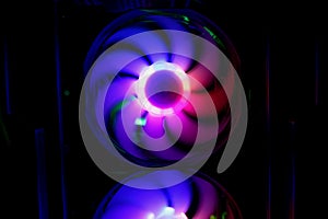 Colorful bright rainbow led rgb pc fan air case cooler. Computer chassis. Gaming modding, technology concept and IT background