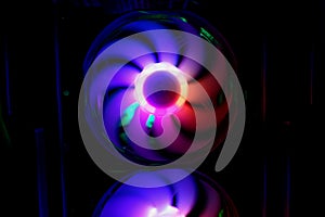 Colorful bright rainbow led rgb pc fan air case cooler. Computer chassis. Gaming modding, technology concept and IT background