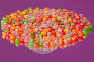 Colorful jelly beans gum spilling. Macro with shallow dof. photo