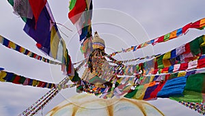 Colorful Buddhist prayer flags on top of famous Boudhanath stupa (Boudha) in the center of Kathmandu, Nepal.