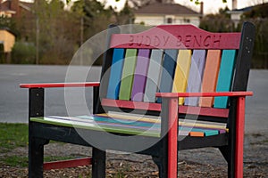 Colorful Buddy Bench at a School in a Residential Neighbourhood