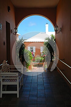 Colorful building through archway in Bermuda