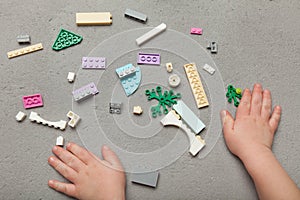 Colorful building blocks with baby hands