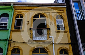 A colorful building in the downtown of Fort de France, Martinique. Colorful house, windows with wooden shutters photo