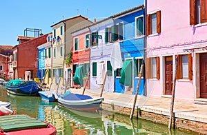 Colorful buildings bu canal in Burano in Venice