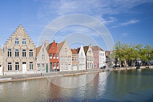 COLORFUL BUILDINGS ON CANAL IN BRUGGES, BELGIUM